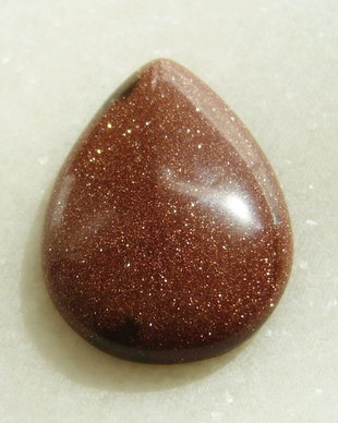 Brown goldstone cabochon 35x25x7.5 mm