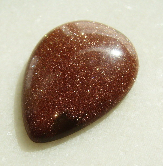 Brown goldstone cabochon 35x25x7.5 mm