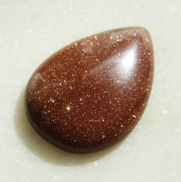 Brown goldstone cabochon 35x25x7.5 mm