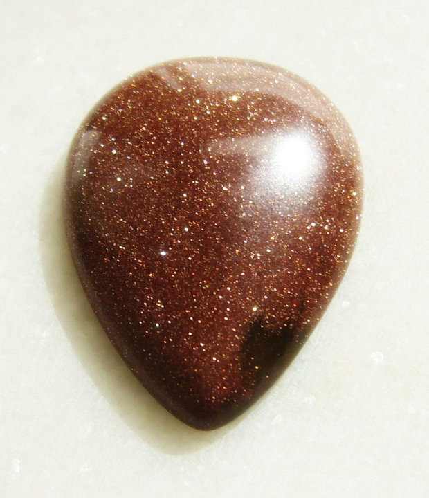 Brown goldstone cabochon 35x25x7.5 mm
