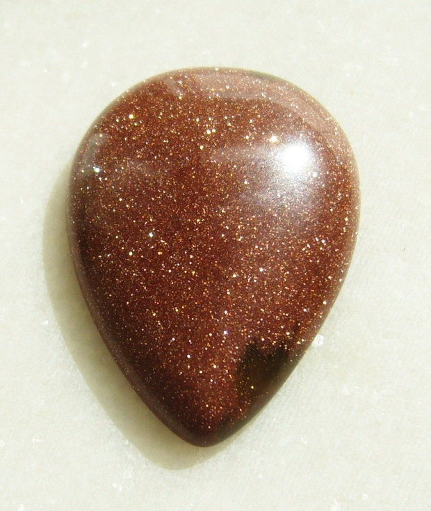 Brown goldstone cabochon 35x25x7.5 mm