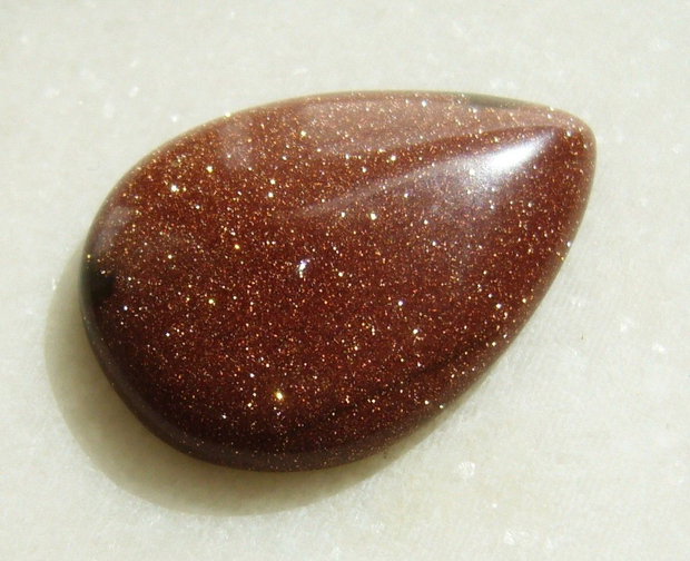 Brown goldstone cabochon 35x25x7.5 mm