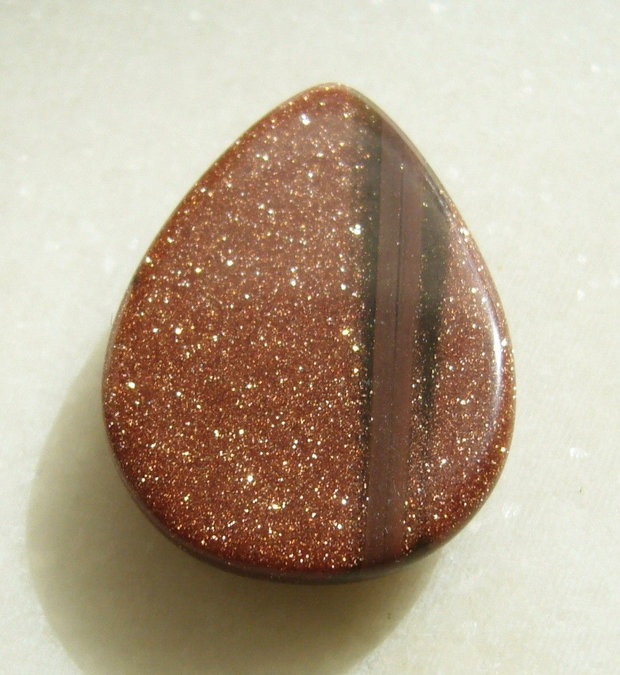 Brown goldstone cabochon 35x25x7.5 mm