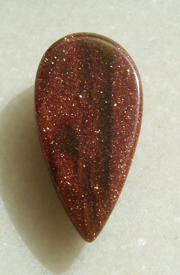 Brown goldstone cabochon 30x15x6 mm