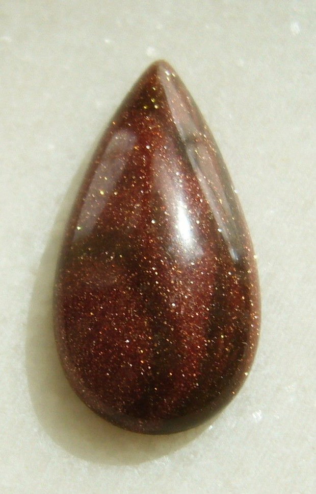 Brown goldstone cabochon 30x15x6 mm