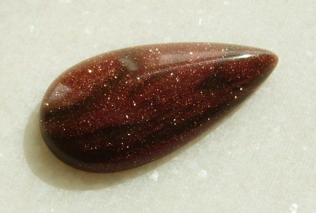 Brown goldstone cabochon 30x15x6 mm