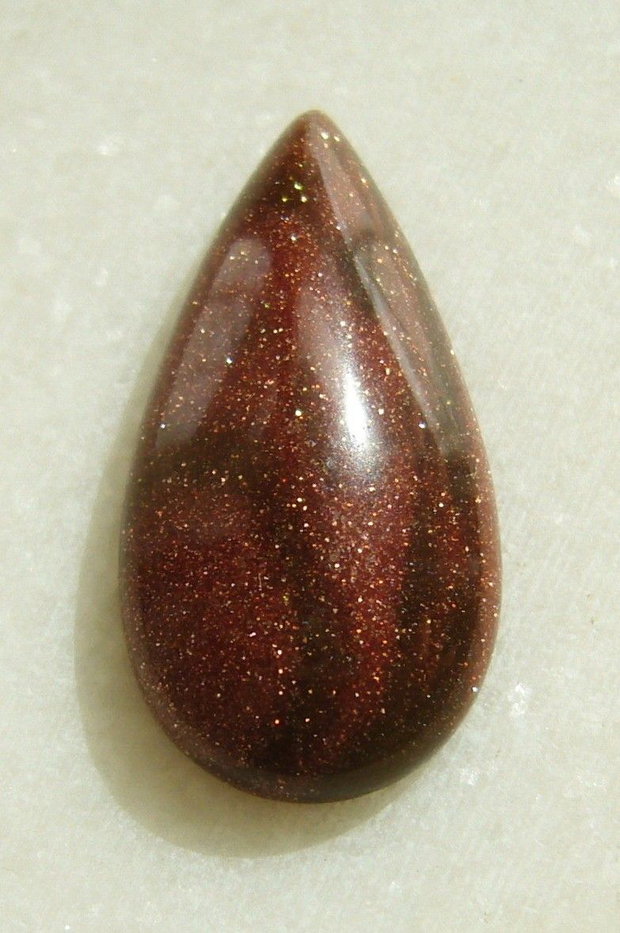 Brown goldstone cabochon 30x15x6 mm