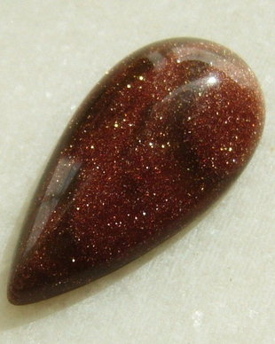 Brown goldstone cabochon 30x15x6 mm