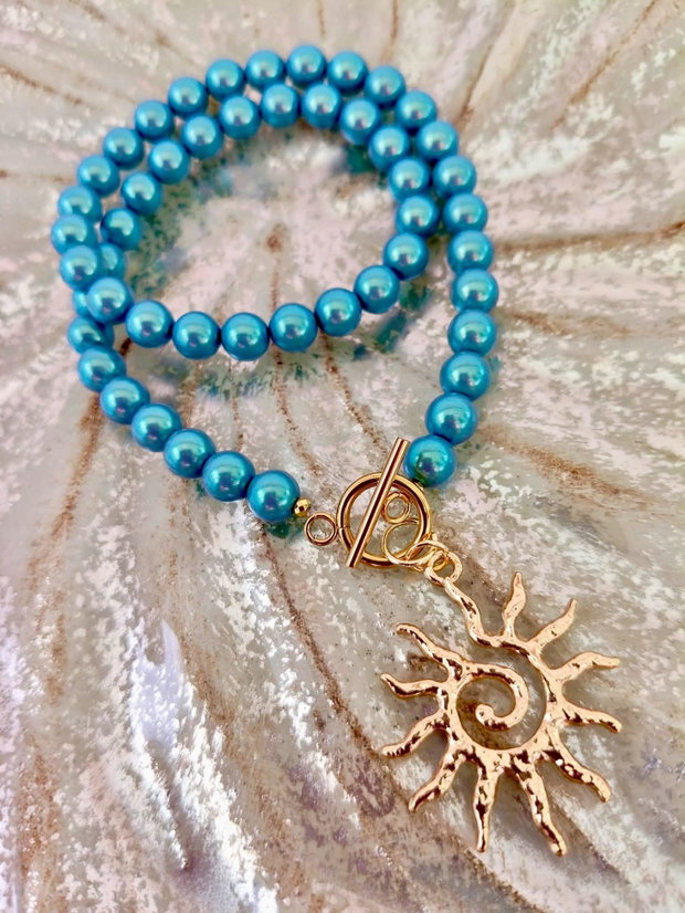 Colier perle Swarovski bleu turcoaz & soare auriu