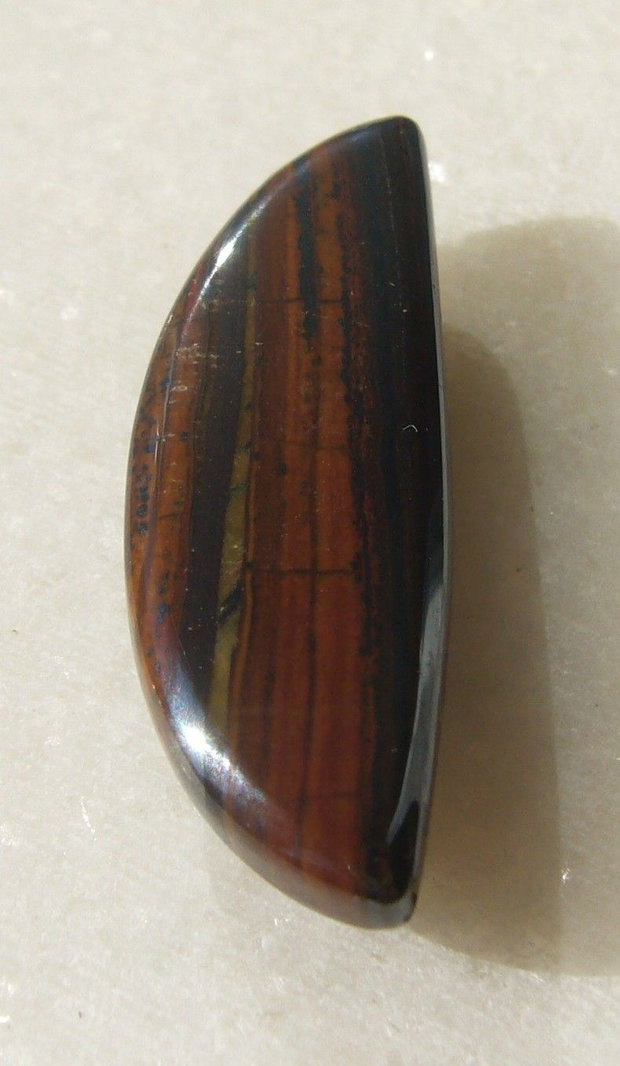 Iron tiger eye cabochon aprox 32.5x11x6.5 mm