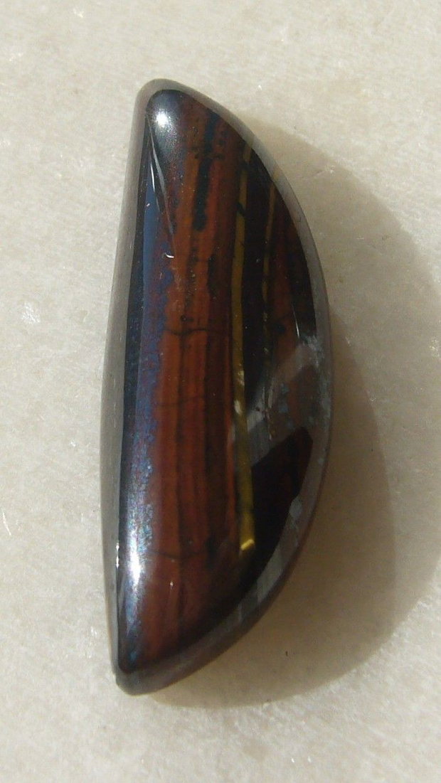 Iron tiger eye cabochon aprox 32.5x11x6.5 mm