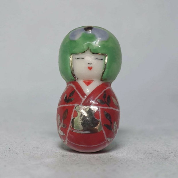 Brosa kokeshi din portelan si platina